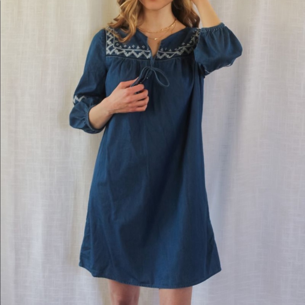 Denim tunic dress with embroidered details and a tassel tie front